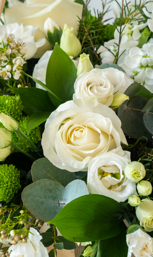 A large sympathy Double Ended Spray - funeral florals made to your theme and requirement. White roses, greenery, sympathy flowers