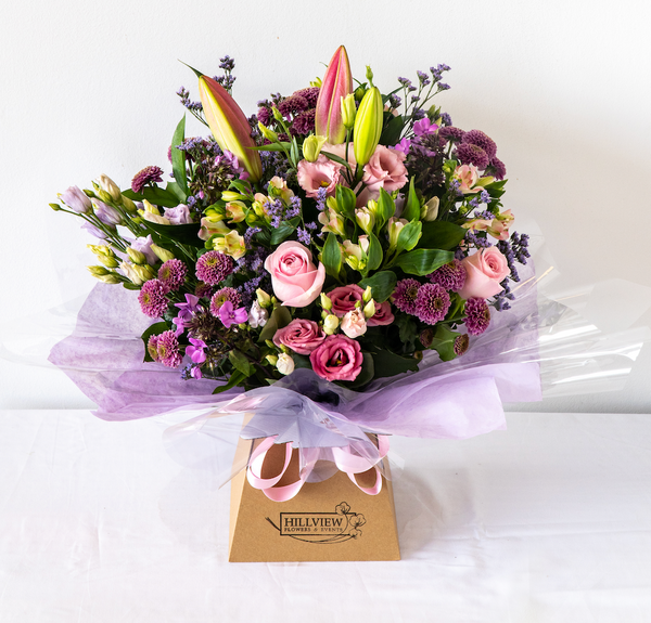 Hayley Aqua Pack - Soft, pretty and delicate lilac floral arrangement of Lisianthus, long lasting Carnations, Alstromeria and Liminioum. Seasonal bouquet in an aqua pack for same day delivery in Bournemouth.