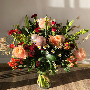 Festive Vase - Beautiful festive flowers displayed in a vase. Christmas bouquet with Fir-cones, Baubles, glitter and Ribbon - same day delivery in Bournemouth.