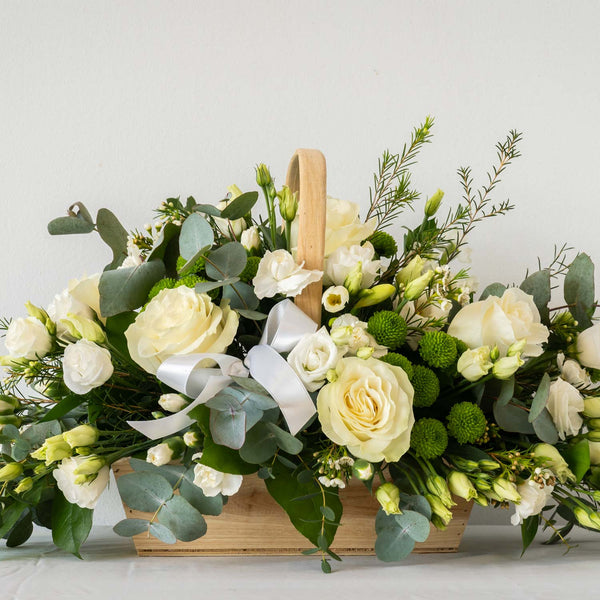 Danielle Basket - A classic, stylish and sophisticated natural white bouquet with greenery and eucalyptus displayed in a basket, for next day delivery in Bournemouth.