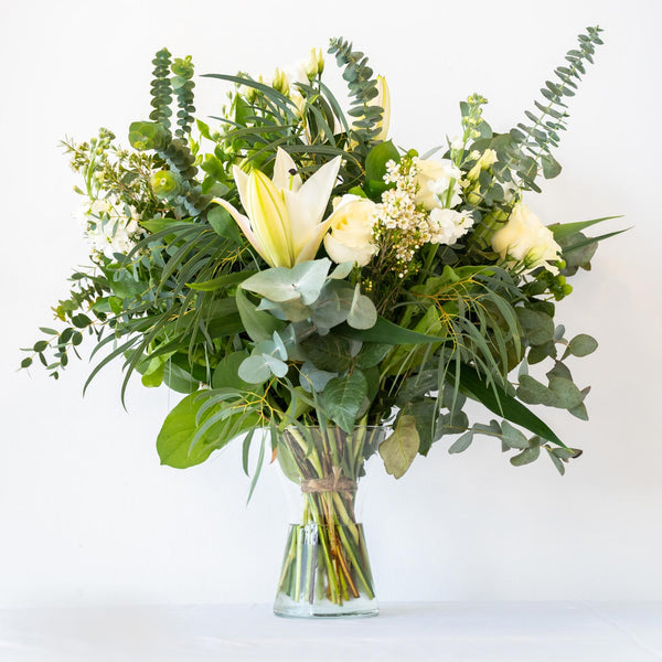 Danielle Vase - A classic, stylish and sophisticated natural white bouquet with greenery and eucalyptus displayed in a vase, for next day delivery in Bournemouth.