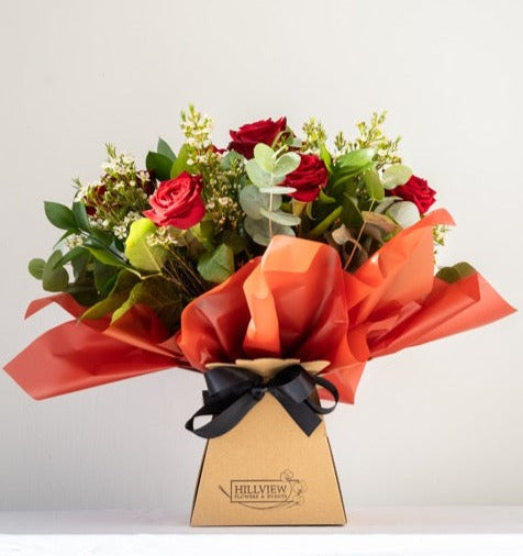 Dozen Red Roses -  12 long stemmed Red Roses with foliage and filler flower, hand created into a water aqua pack for freshness. The ultimate I love you. Same day delivery in Bournemouth. 