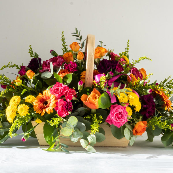 Emily Basket - A colourful, vibrant and bold bouquet with Gerbera’s, Santini and Hypericum Berries. Displayed in a basket, same day delivery in Bournemouth.