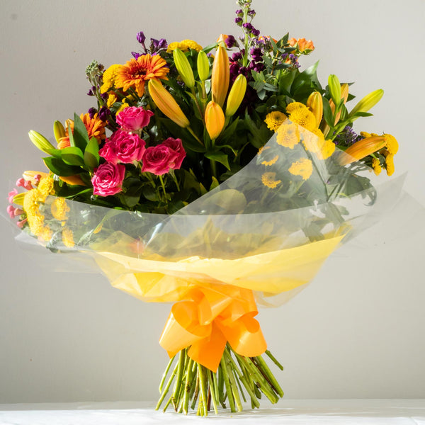 Emily Hand-Tied, Emily Aqua Pack - A colourful, vibrant and bold bouquet with Gerbera’s, Santini and Hypericum Berries. Hand-tied, same day delivery in Bournemouth.