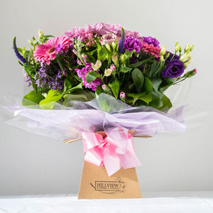 Hayley Aqua Pack - Soft, pretty and delicate lilac floral arrangement of Lisianthus, long lasting Carnations, Alstromeria and Liminioum. Seasonal bouquet in an aqua pack for same day delivery in Bournemouth.