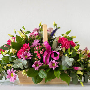 Hayley Basket - Soft, pretty and delicate lilac floral arrangement of Lisianthus, long lasting Carnations, Alstromeria and Liminioum. Seasonal bouquet in basket for same day delivery in Bournemouth.