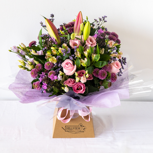 Hayley Aqua Pack - Soft, pretty and delicate lilac floral arrangement of Lisianthus, long lasting Carnations, Alstromeria and Liminioum. Seasonal bouquet in an aqua pack for same day delivery in Bournemouth.
