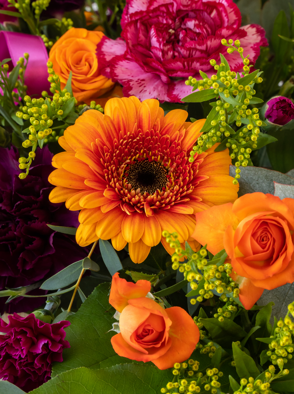 A large sympathy Double Ended Spray - funeral florals made to your theme and requirement. Bright, colourful, vivid funeral flowers
