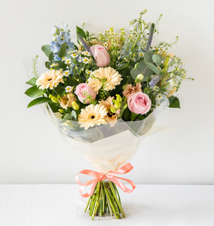 Sophie Hand-tied - elegant, calm and relaxing pastel bouquet with Freesia, handpicked Delphinium and soft foliage. Hand-tied for same day delivery in Bournemouth.